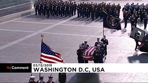 Emotional George W. Bush watches his father's casket arrive at US Capitol