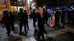 A man dons a Macron mask at a Gilets Jaunes protest in Marseille