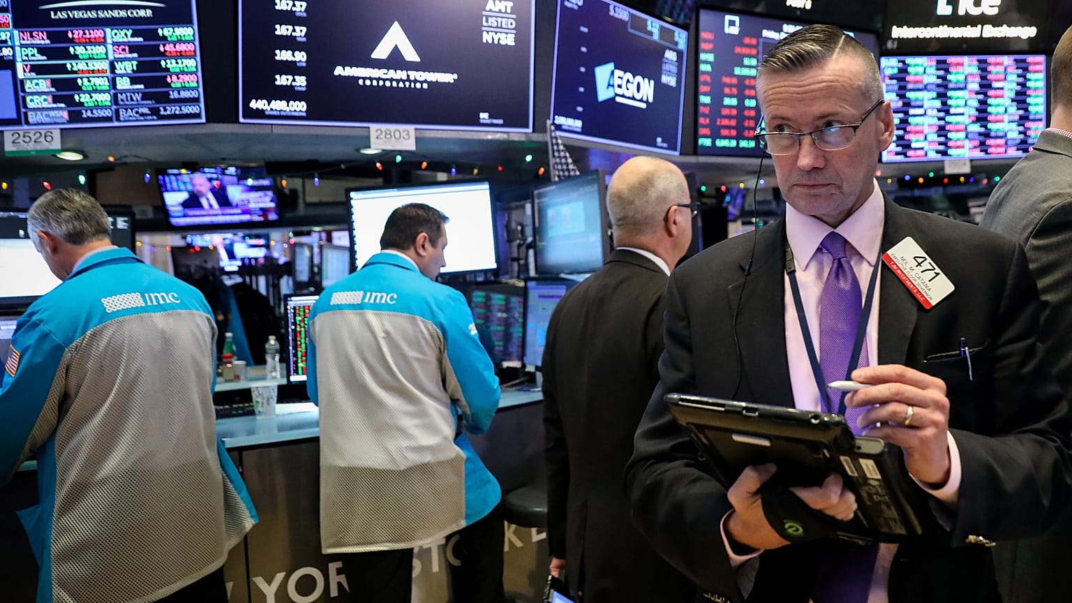 Traders work on the floor of the NYSE in New York