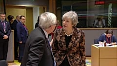 Theresa May and Jean-Claude Juncker caught on camera in tense exchange