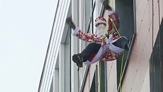Flying Santas bring cheer to a Moscow children's hospital