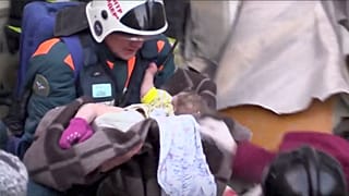 Watch: 'Miracle baby' pulled from rubble as number of dead in building collapse rises to 21