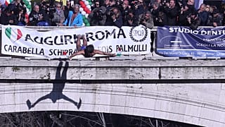 Walter Schirra, dives into the Tiber River from the Cavour bridge in Rome