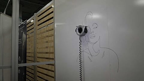 Robots at CES: From live interpreters to painters