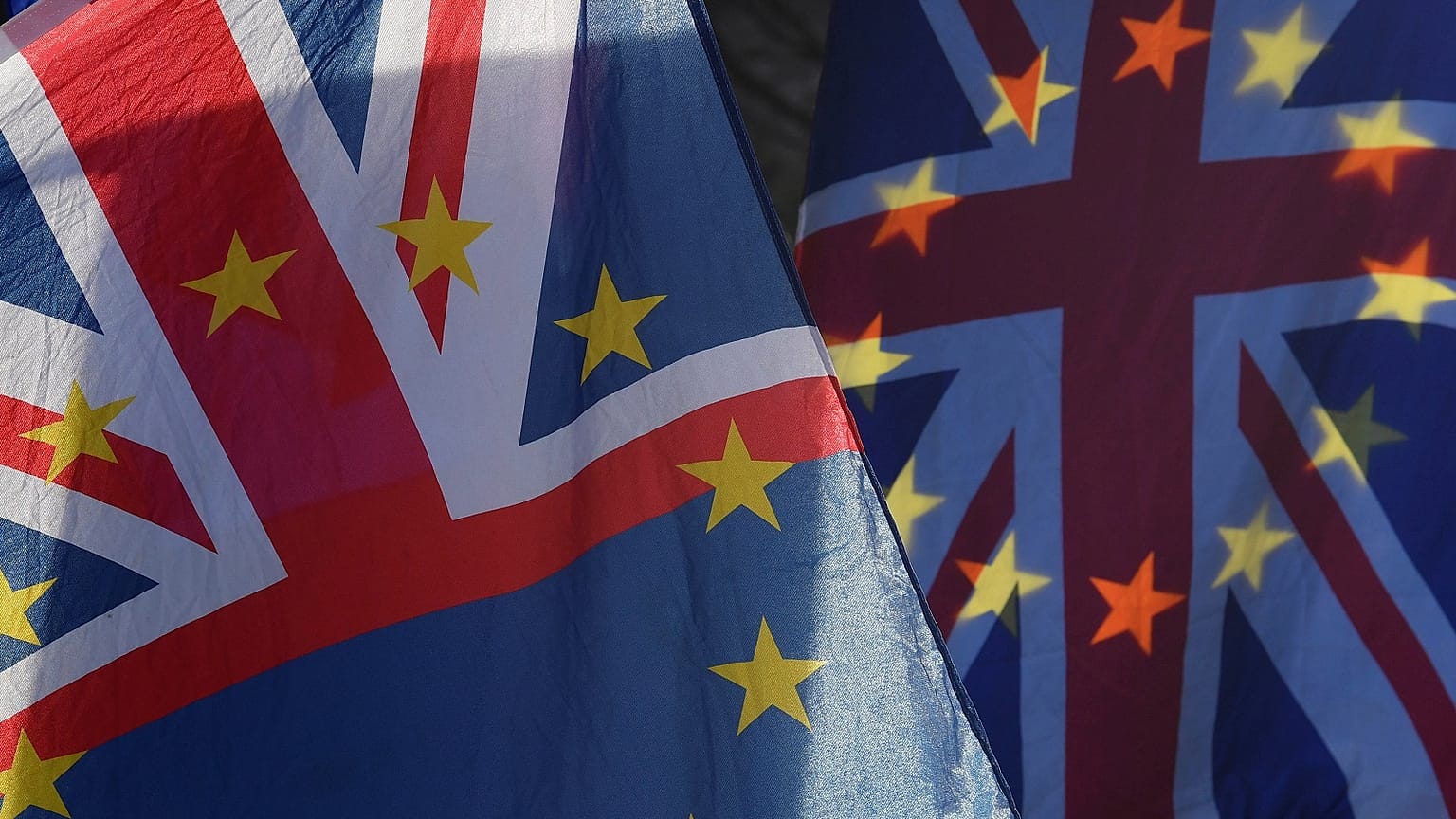 Union flags incorporating the EU stars seen outside the UK parliament.