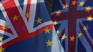 Union flags incorporating the EU stars seen outside the UK parliament.