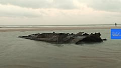 WW1 German submarine emerges from French beach