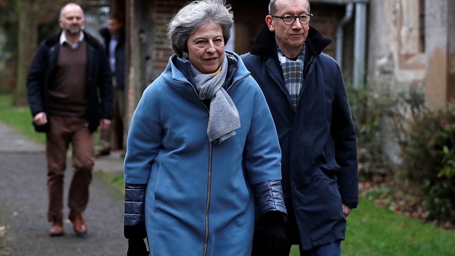 Theresa May leaves church near High Wycombe with husband Philip. 