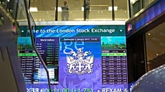 British stocks shrug off politics as results drive big moves