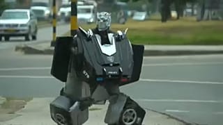Beggar dressed as a "Transformer" on a Bogota street