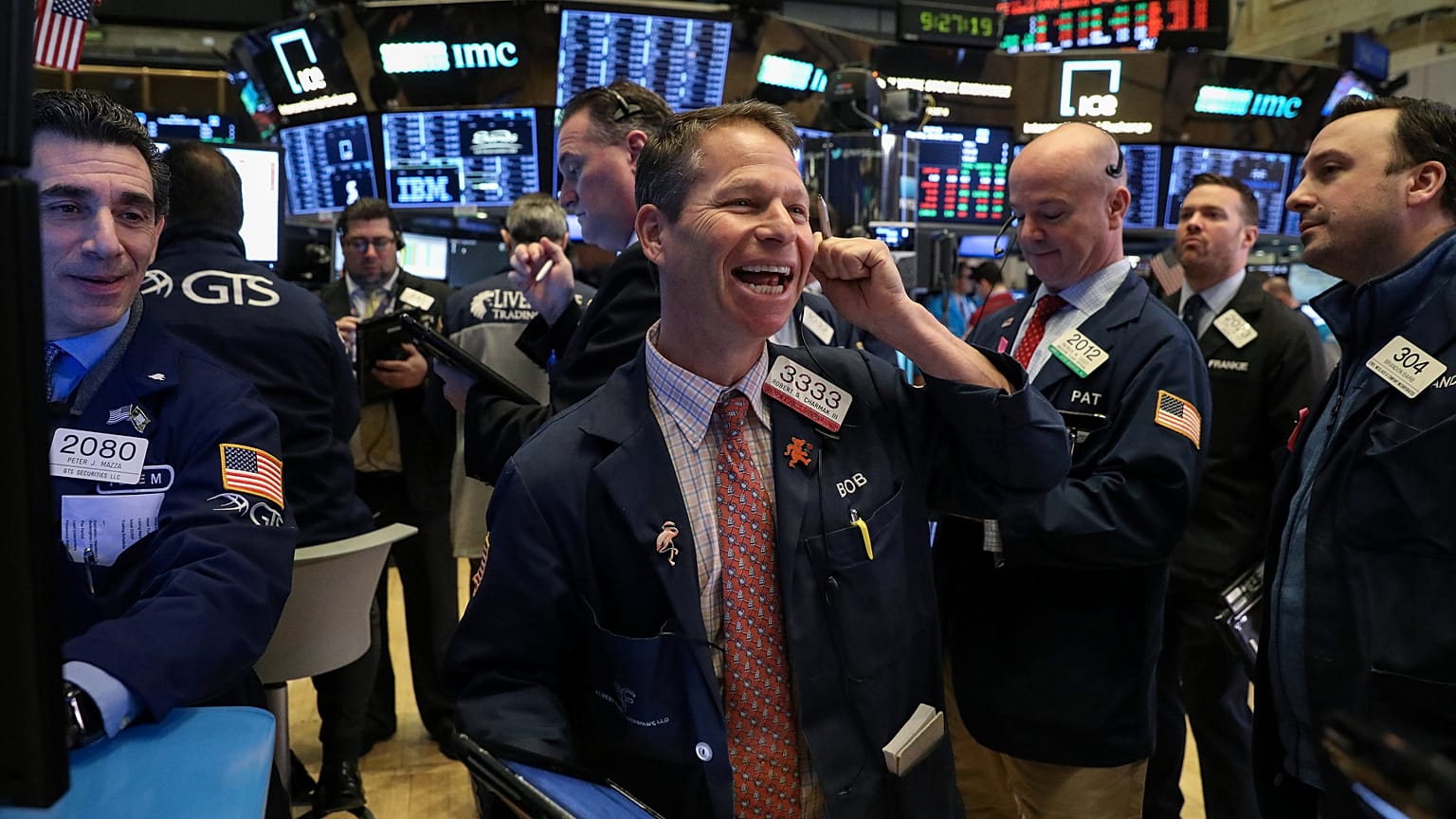 Traders work on the floor of the NYSE in New York