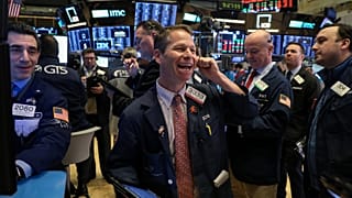 Traders work on the floor of the NYSE in New York