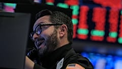 A trader works on the floor of the NYSE in New York