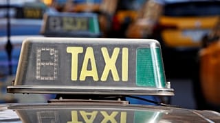 A taxi is pictured in Barcelona during a protest against ride-hailing apps.