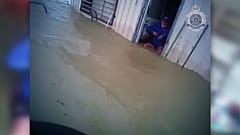 Police rescue elderly man during Queensland flood