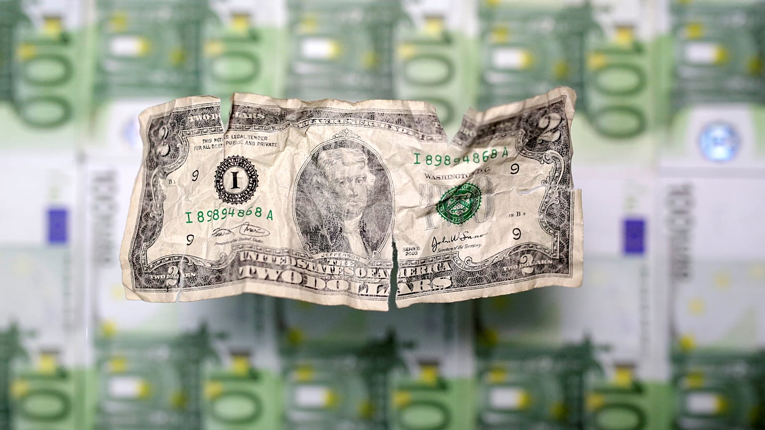 U.S. dollar and euro banknotes are seen in this picture illustration