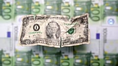 U.S. dollar and euro banknotes are seen in this picture illustration