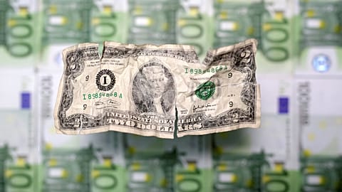 U.S. dollar and euro banknotes are seen in this picture illustration