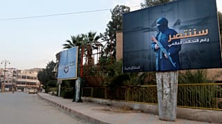 An IS billboard in Raqqa reads: 'We will win despite the global coalition'