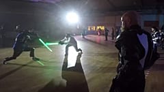 Duelling takes place in the dark with replica lightsabers