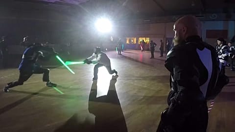 Duelling takes place in the dark with replica lightsabers