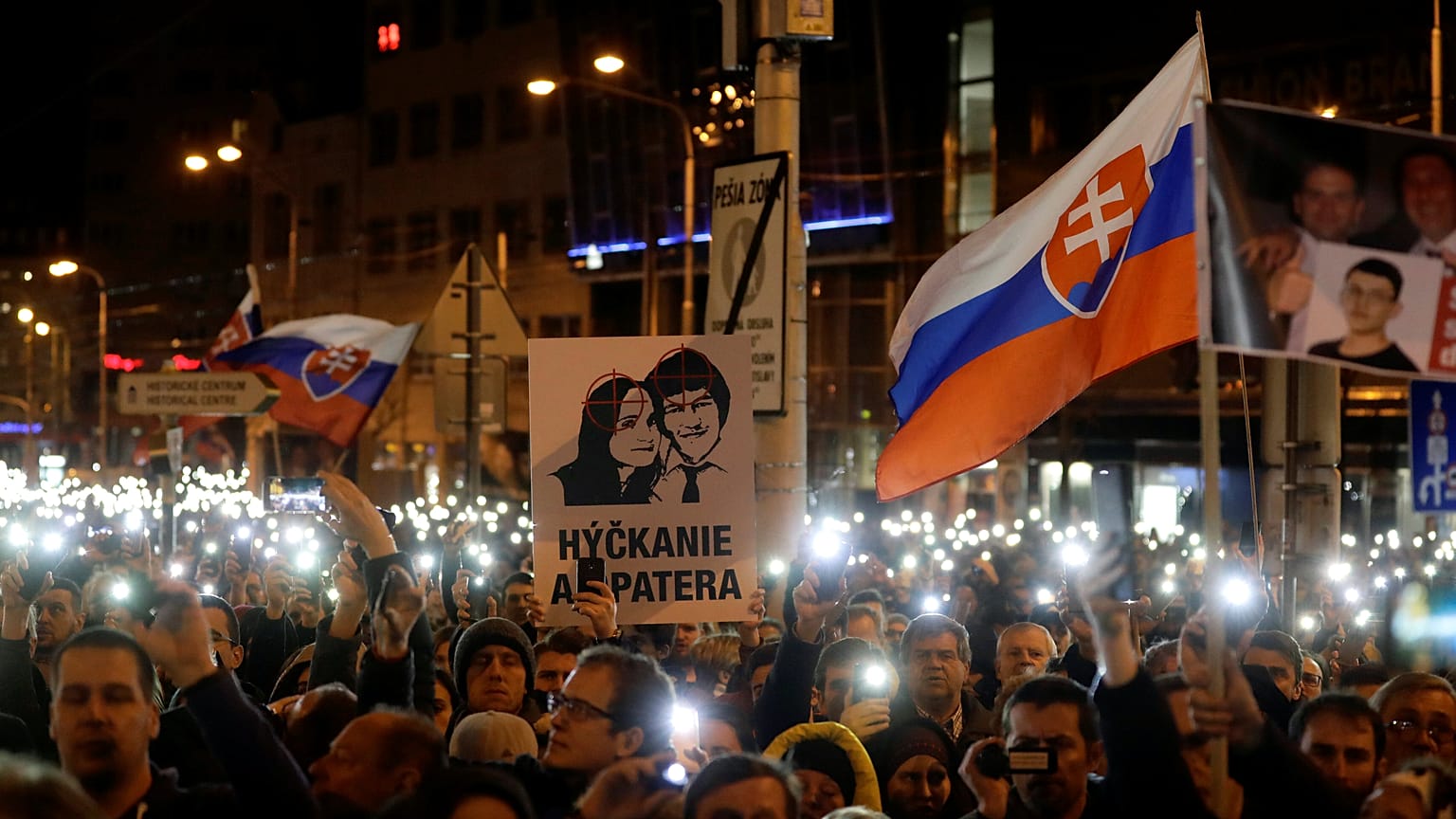 Demonstrators at a protest marking the anniversary of Kuciak's killing