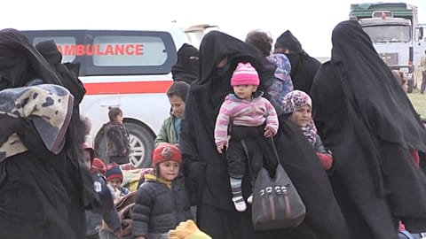 Syrian civilians arrive at screening centre as they flee last ISIS stronghold