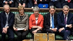 Britain's Prime Minister Theresa May reacts after the results of the vote