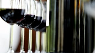 Glasses and bottles of Chateau Belcier red wine in Saint Emilion