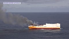 France battles to stop oil spill spreading after cargo ship sinks
