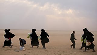 Families from the Islamic State Caliphate surrender in Syria.