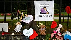 Signs at a memorial site for victims of the Christchurch mosque shootings