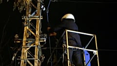 Nicolae Robu cutting telecommunications cables.
