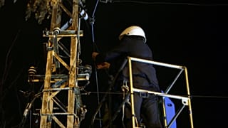 Nicolae Robu cutting telecommunications cables.