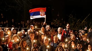 Demonstrators attend a protest against President Aleksandar Vucic 