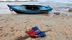 A boat used by migrants is seen near the western town of Sabratha