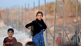 لاجئة سورية في مخيم أطمة