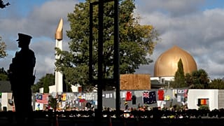 A police officer stands guard outside Al Noor mosque in Christchurch