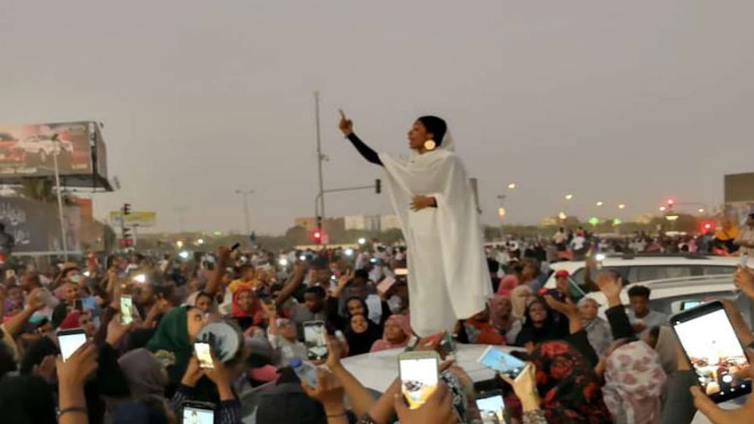 Female protester in Khartoum, 8 April 2019