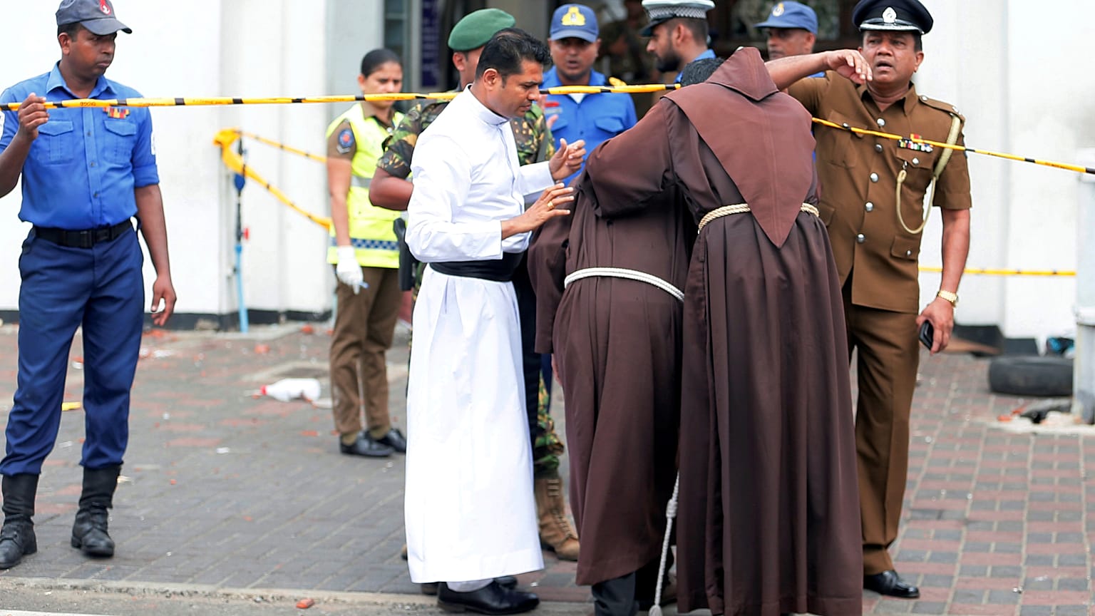 Priests near the entrance to St Anthony's