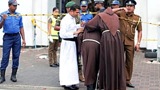 Priests near the entrance to St Anthony's