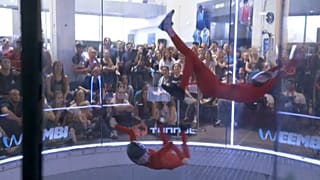 Competitors skydive in the wind tunnel