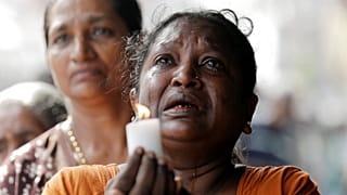 Colombo residents observe a moment of silence