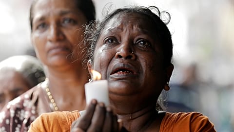 Colombo residents observe a moment of silence