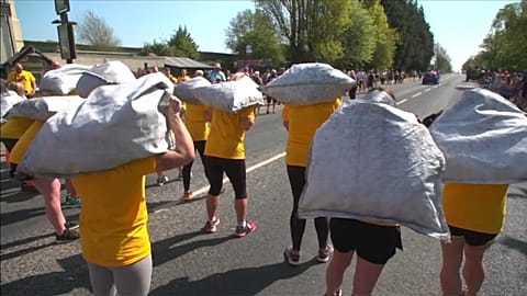 The women carried 20 kilograms of coal while the men carried 50 kilos.