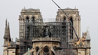 Roof renovation company says workers smoked on top of Notre Dame but rules out that as cause