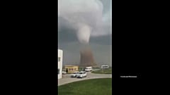 Watch: Powerful tornado touches down in Romanian countryside leaving wreckage behind