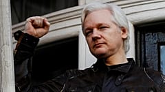 Julian Assange refuses to surrender to US extradition at court hearing in London