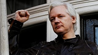Julian Assange refuses to surrender to US extradition at court hearing in London