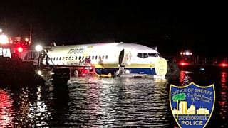 Florida plane crash: Boeing 737 skids off runway at Jacksonville military base and into river